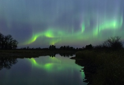 a curtain of green light in the sky